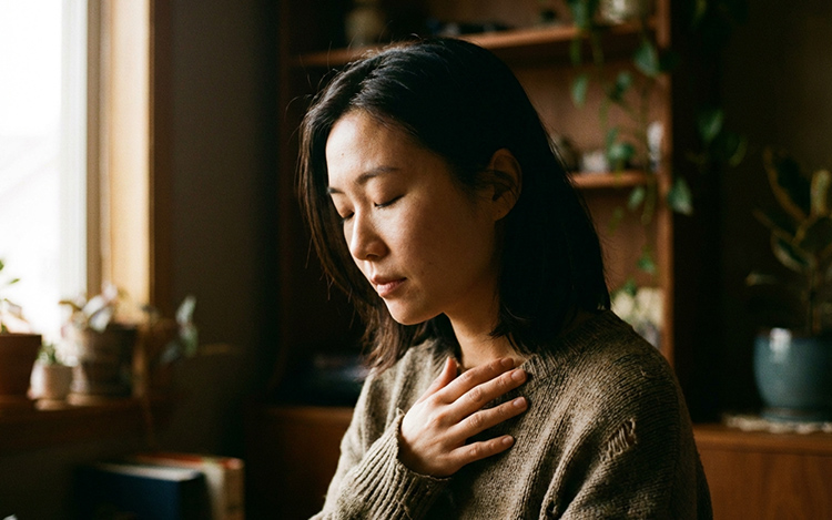 Person showing vulnerable emotional expression and authentic feelings in intimate moment
