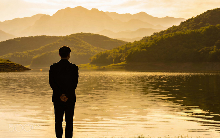 Person contemplating personal journey and relationship readiness in peaceful natural setting